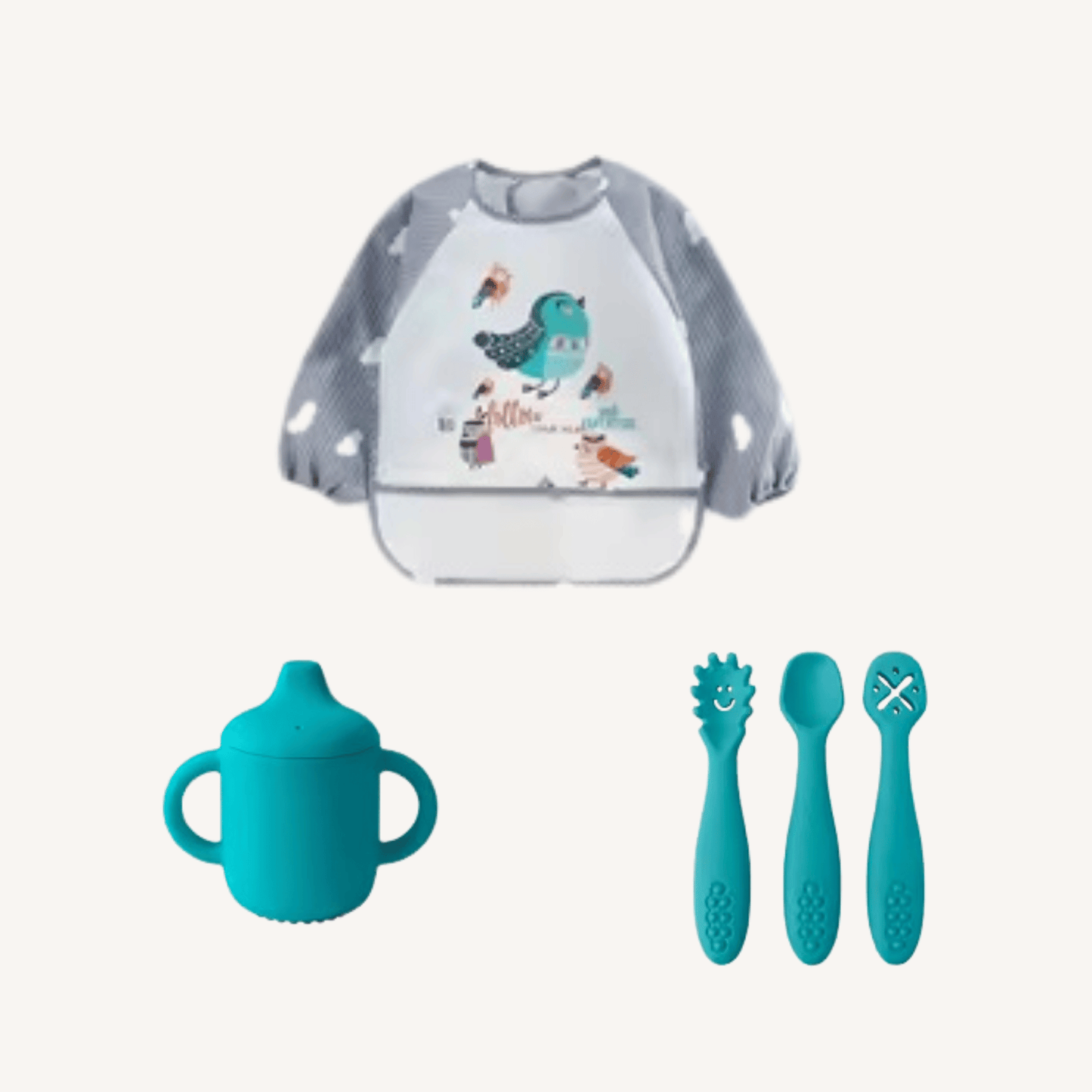 Baby bib with cartoon design, blue sippy cup, and baby utensils on a white background