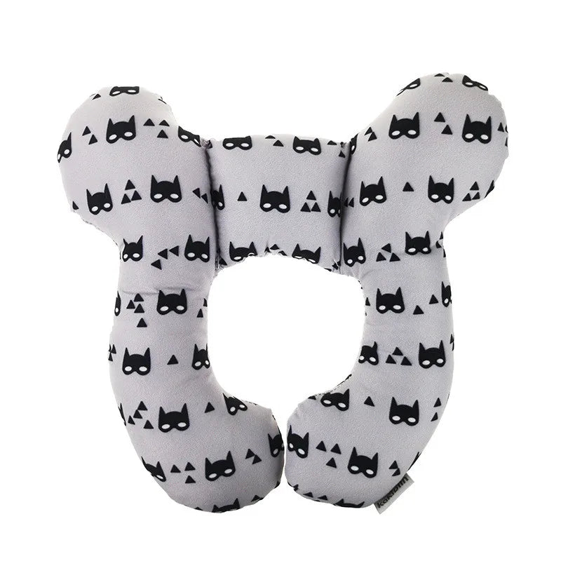 Gray neck pillow with black cat mask pattern on a white background