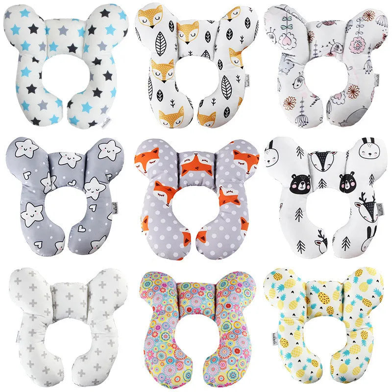 Collection of baby neck support pillows with various patterns on a white background