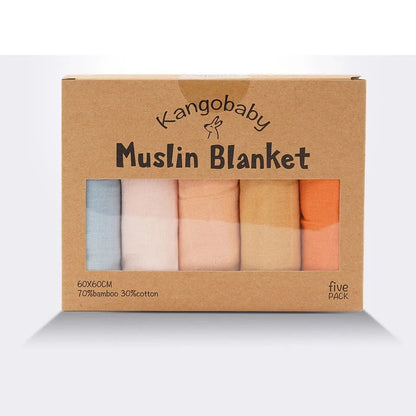 Orange muslin blanket with KangaBaby packaging in the background