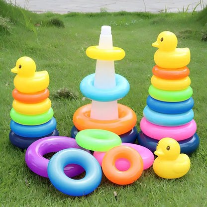 Colorful inflatable rings and rubber ducks on grass