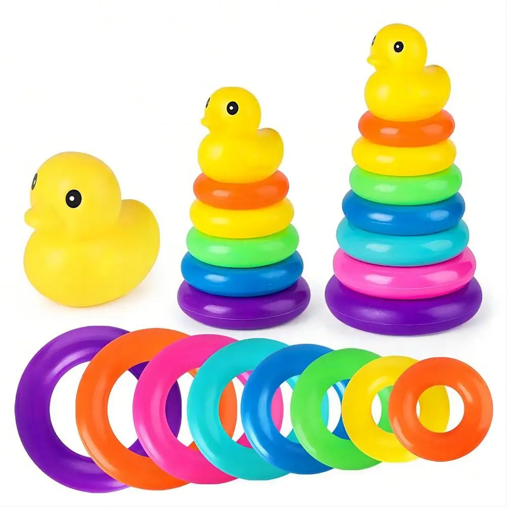 Colorful ring stacking toys with a rubber duck on a white background
