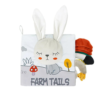 Plush toy with rabbit ears on a 'Farm Tails' book