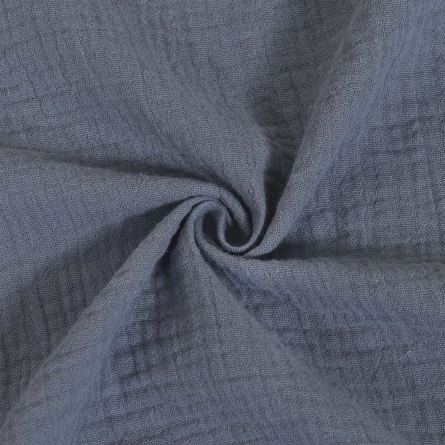 Close-up of textured blue fabric with a swirl pattern