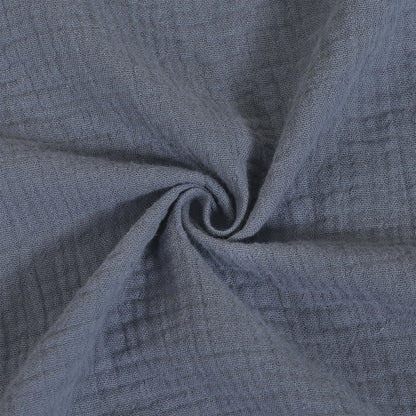 Close-up of textured blue fabric with a swirl pattern