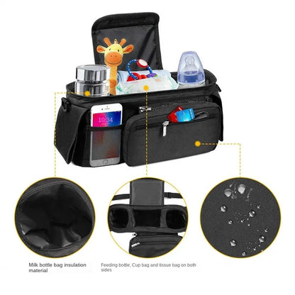 Black baby bag with various compartments and items on a white background