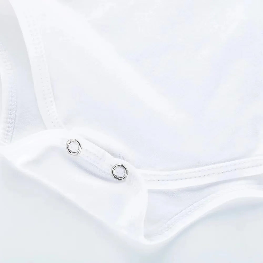 Close-up of a white garment with a zipper detail on a light gray background