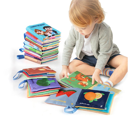 Child playing with colorful soft books on a white background