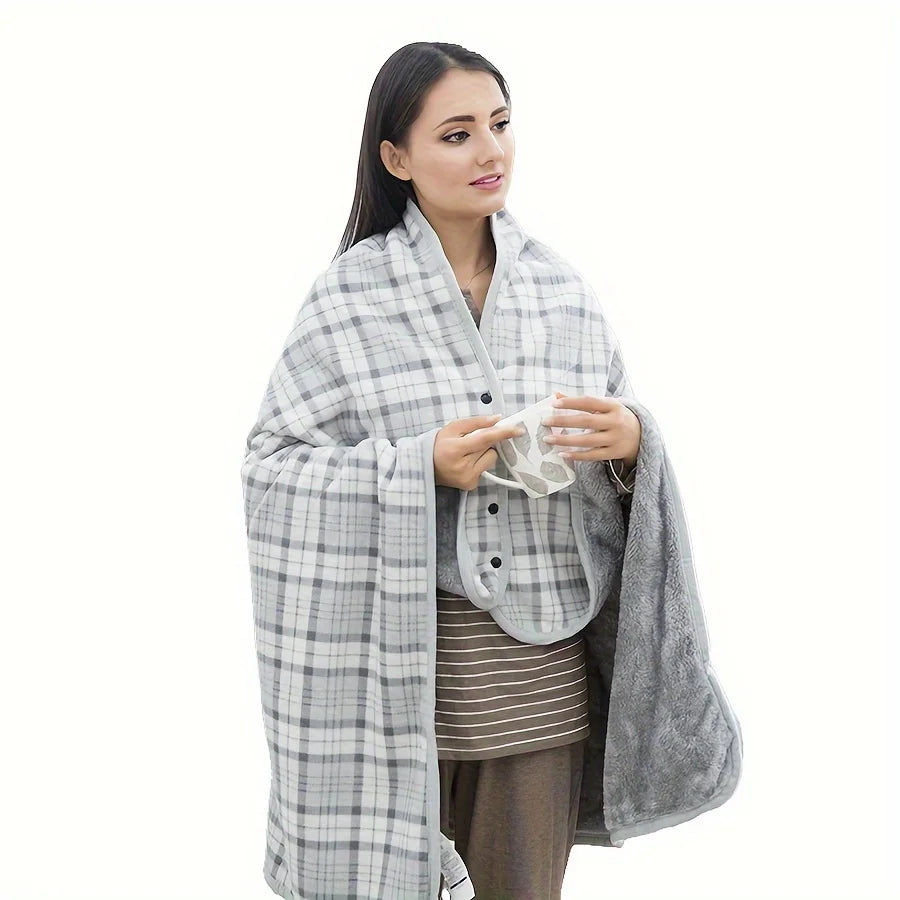 Woman wrapped in a gray checkered blanket on a white background