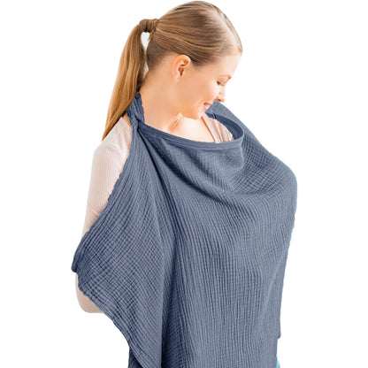 Woman wearing a blue baby carrier on a white background