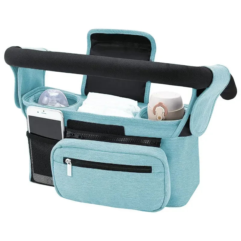 Teal car seat organizer with black handle and pockets on a white background