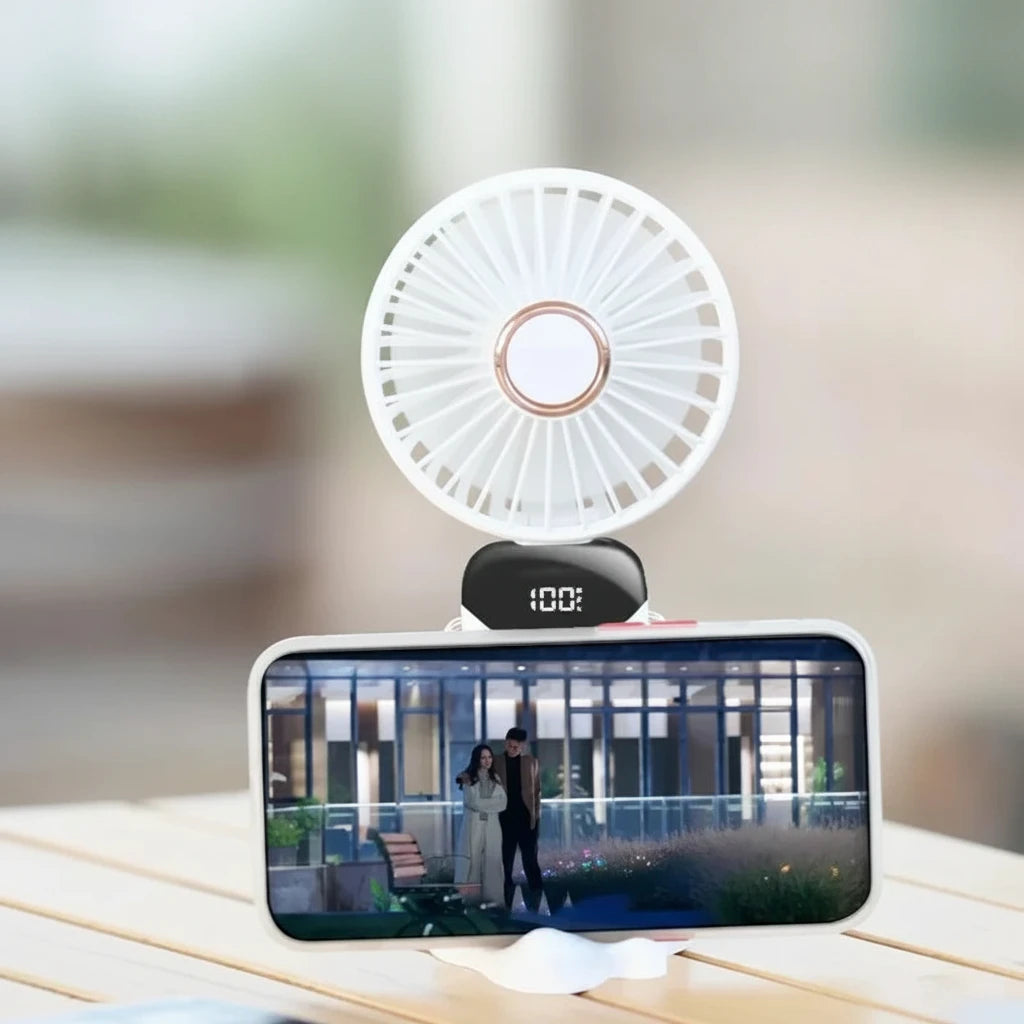 Small fan attached to a smartphone displaying a video, with text about cooling off while watching drama.