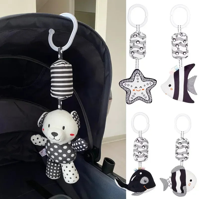 Baby toy with teddy bear design attached to a stroller, with additional toy designs shown on the right.