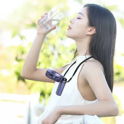 Person wearing a lanyard with a fan attached, standing outdoors.