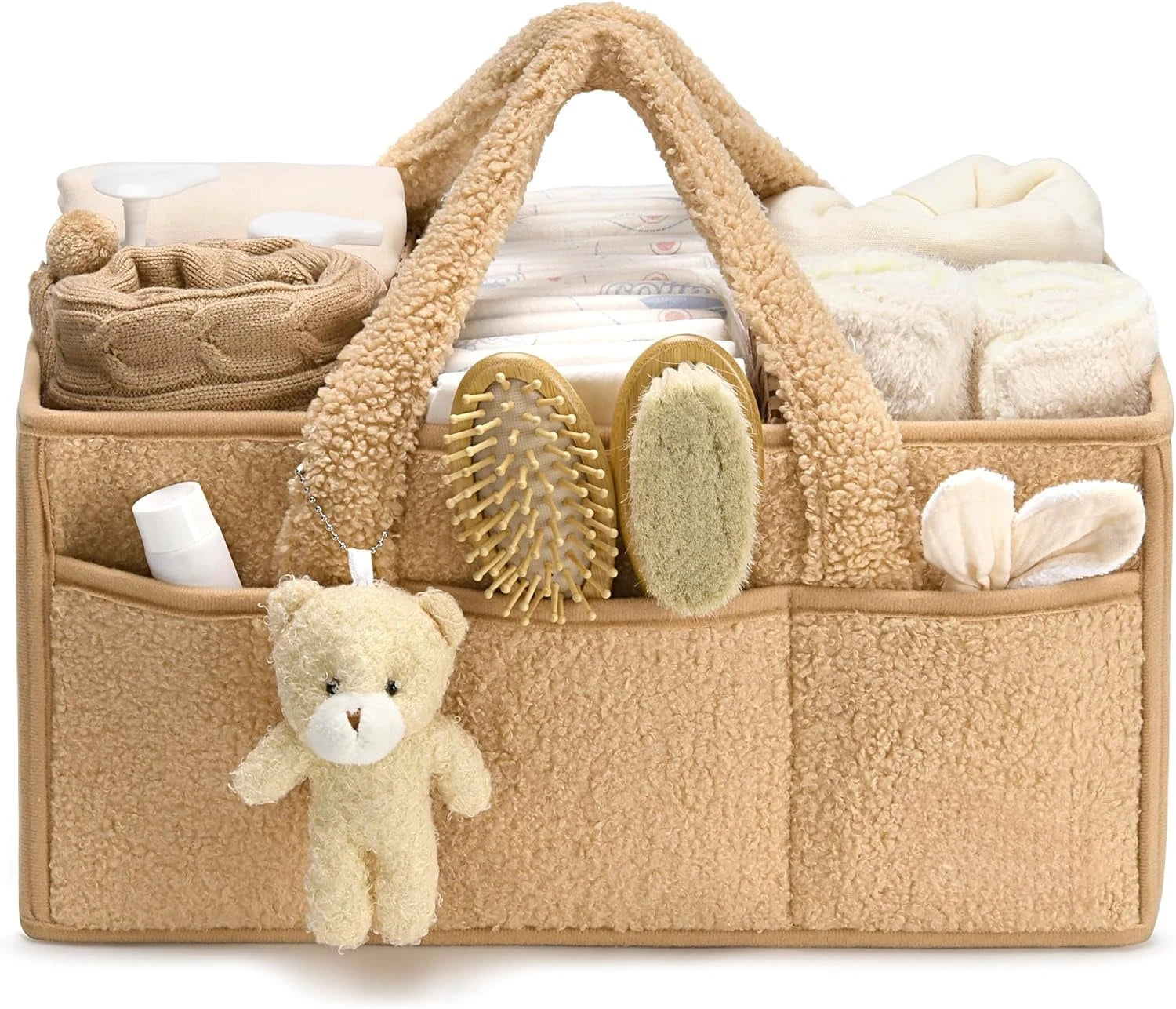 Beige baby organizer with baby items including a teddy bear, on a white background
