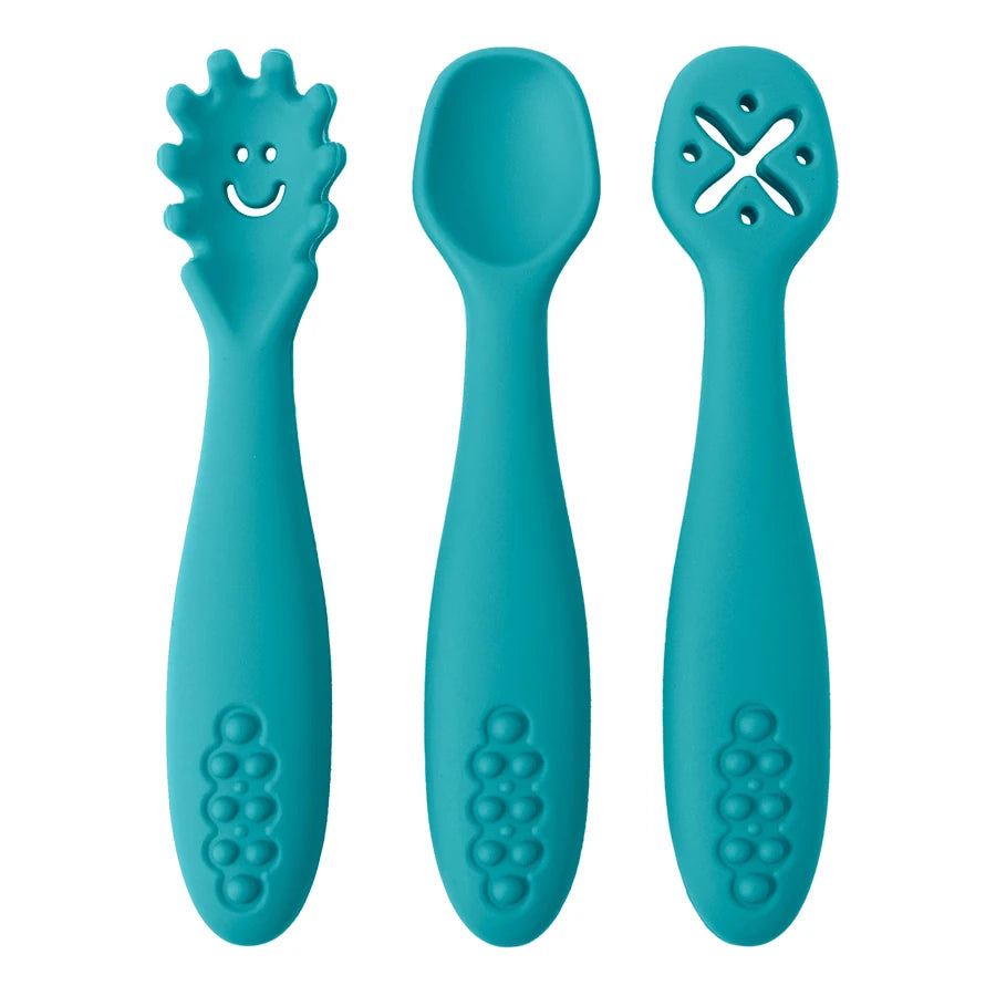 Three turquoise baby utensils with different designs on a white background