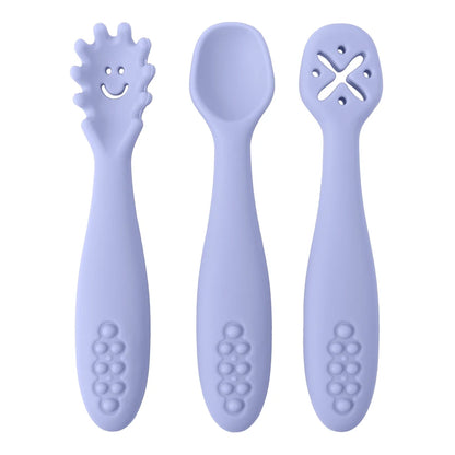 Three purple baby utensils with different designs on a white background