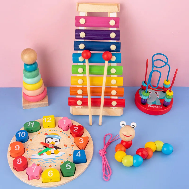 Collection of colorful wooden toys on a blue and pink gradient background