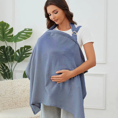 Woman wearing a blue baby carrier with a white background