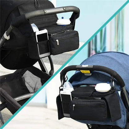Black stroller organizer with phone holder and diaper bag attached to a stroller.