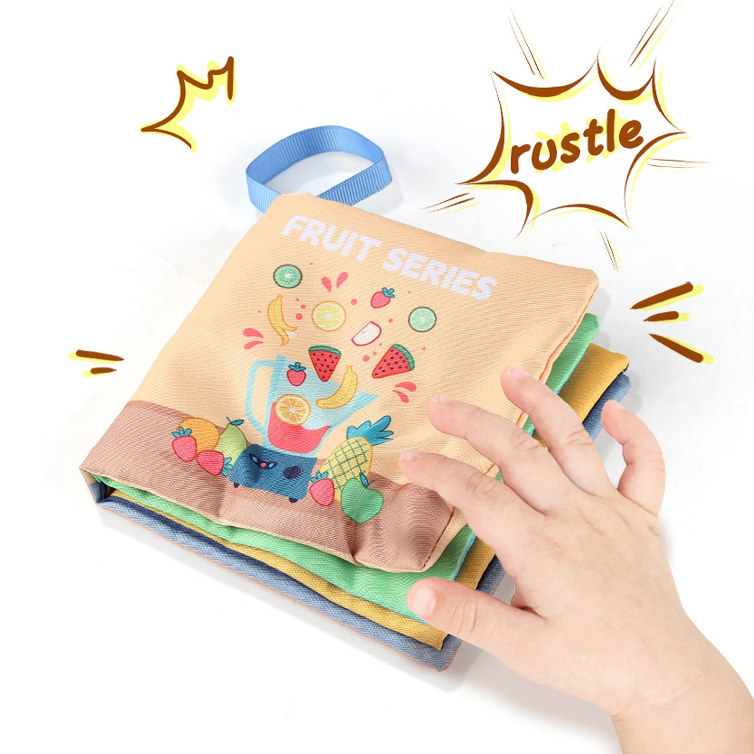 Children's soft book with fruit illustrations held by a hand on a white background