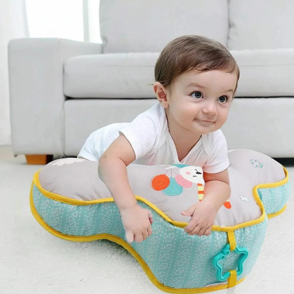 Baby sitting on a colorful cushion with toys, surrounded by text descriptions of features.