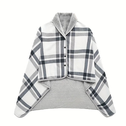 Plaid shirt over a gray sweater on a white background